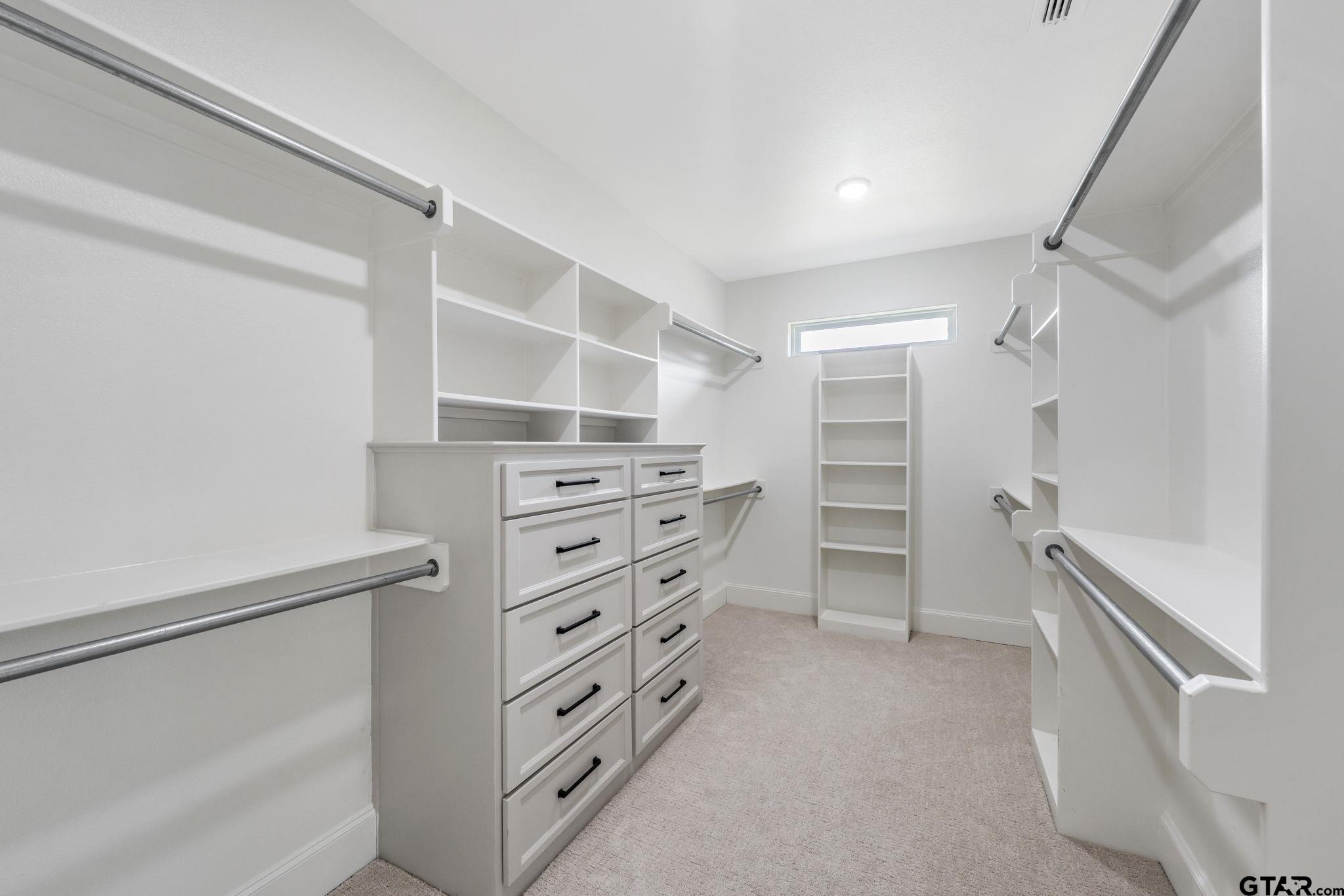 15601 Stampede Run Tyler, TX 75703 - Photo 26 of 48 a view of walk in closet with empty racks