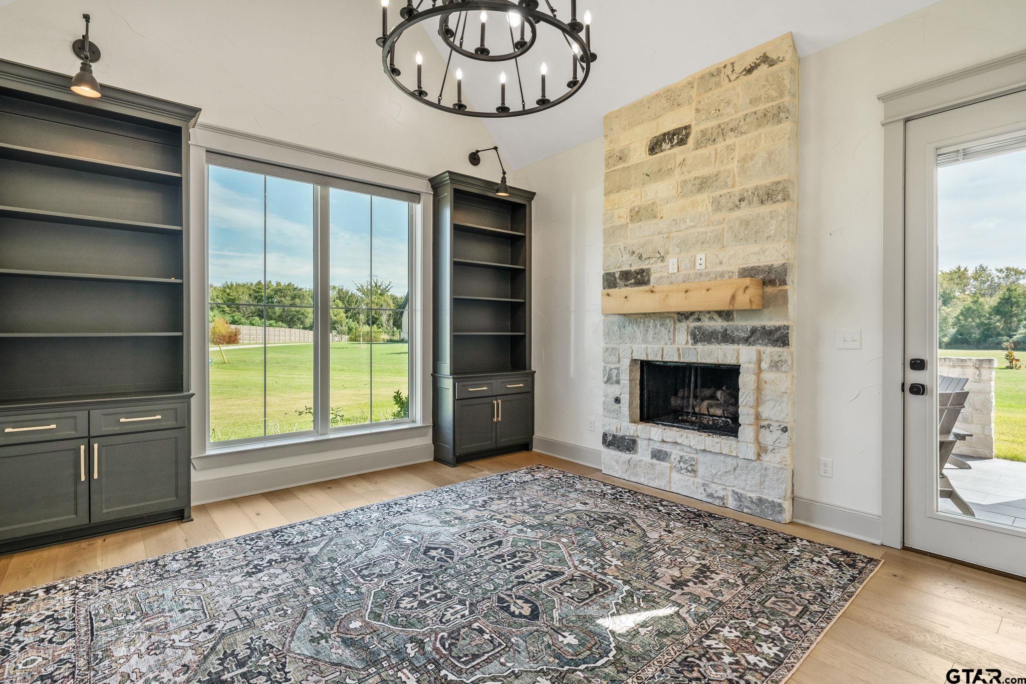 15601 Stampede Run Tyler, TX 75703 - Photo 28 of 48 a view of an empty room with a fireplace and a window