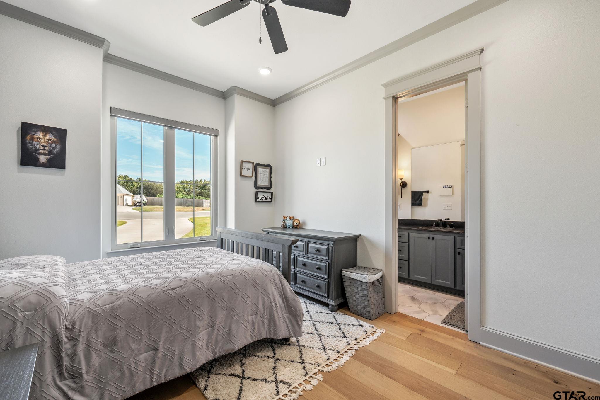 15601 Stampede Run Tyler, TX 75703 - Photo 34 of 48 a bedroom with a bed and a table