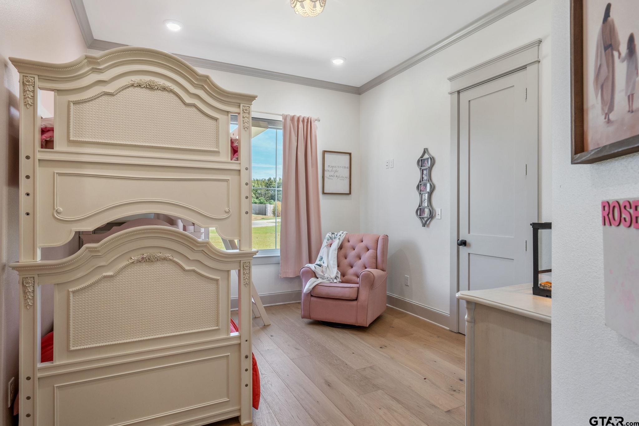 15601 Stampede Run Tyler, TX 75703 - Photo 36 of 48 a living room with furniture and a floor to ceiling window