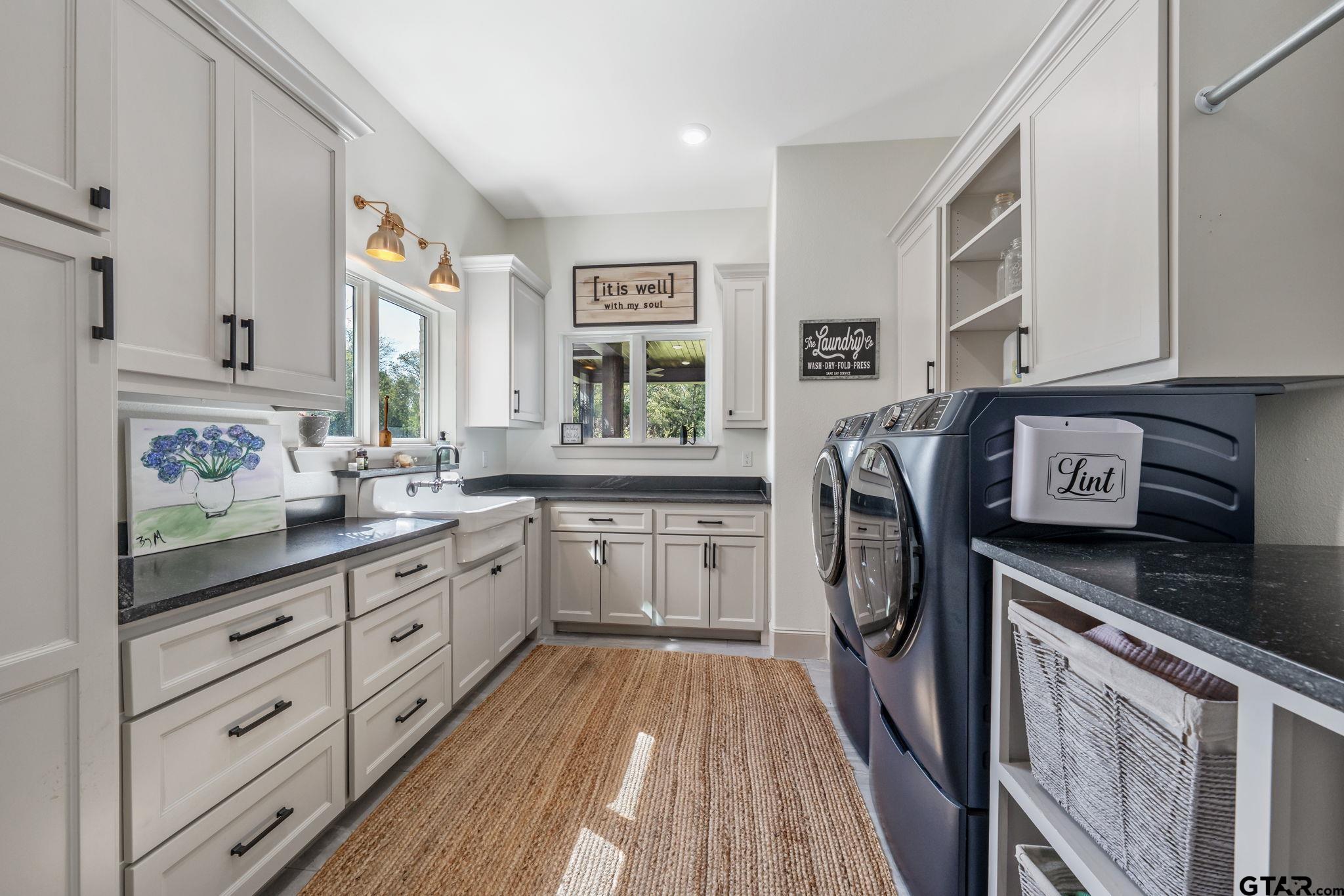 15601 Stampede Run Tyler, TX 75703 - Photo 41 of 48 a kitchen with stainless steel appliances granite countertop a refrigerator a sink dishwasher a stove and white countertops with wooden floor