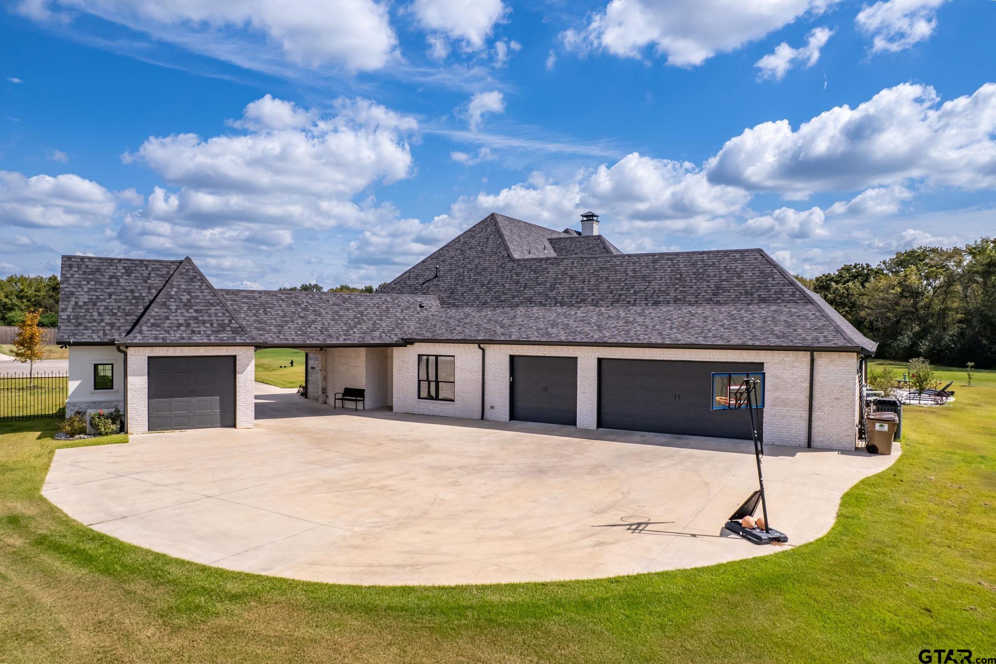 15601 Stampede Run Tyler, TX 75703 - Photo 47 of 48 a front view of a house with a yard