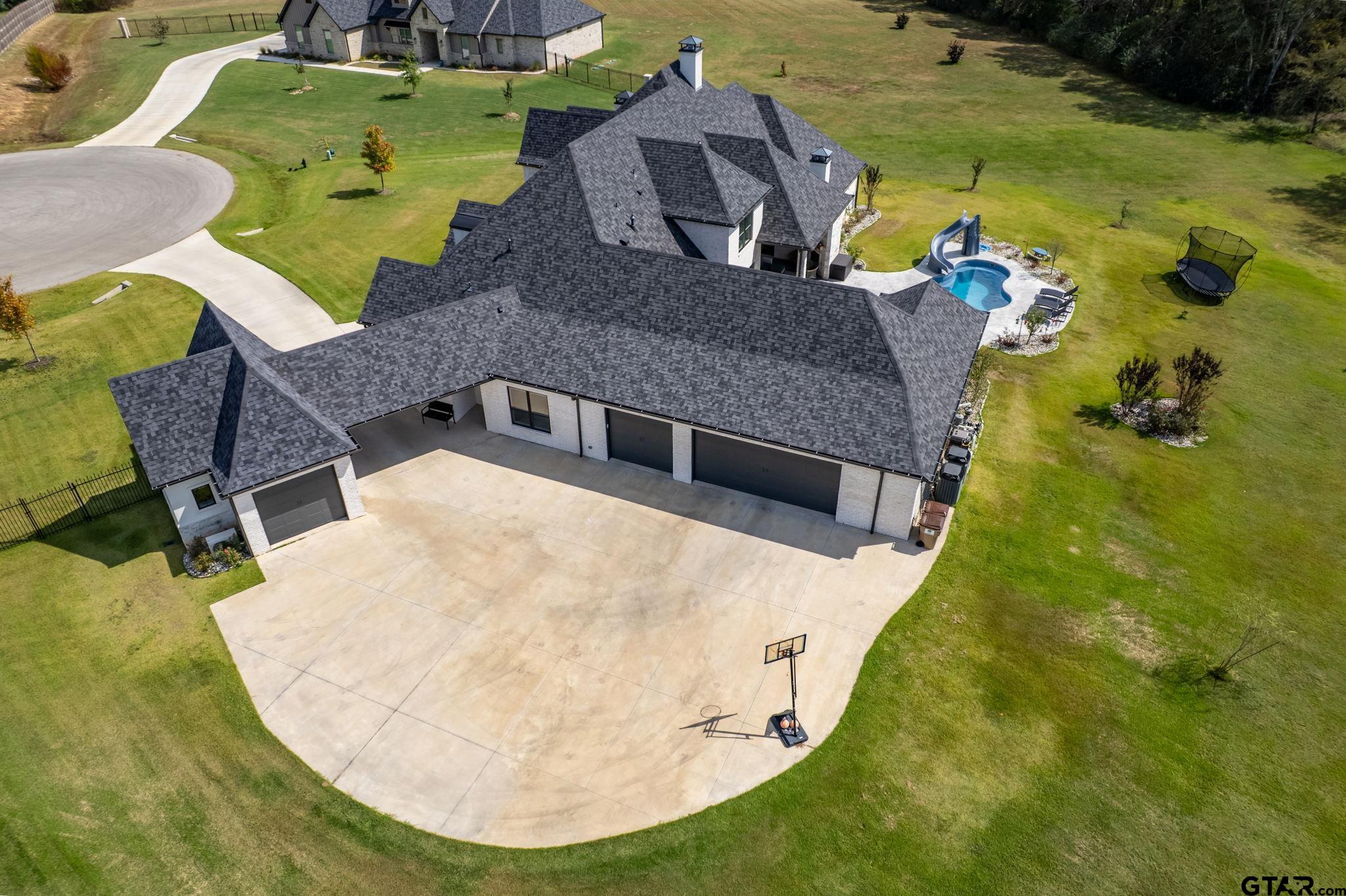 15601 Stampede Run Tyler, TX 75703 - Photo 48 of 48 an aerial view of a house with swimming pool