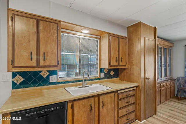 a kitchen with a sink stove and refrigerator
