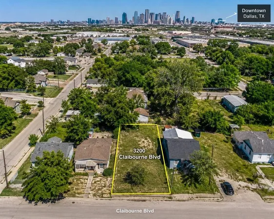 an aerial view of a residential houses with yard