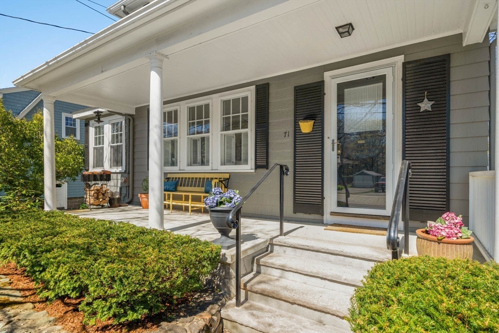 71 Woodside Road Winchester, MA 01890 - Photo 1 of 40 a living room filled with furniture and a garden