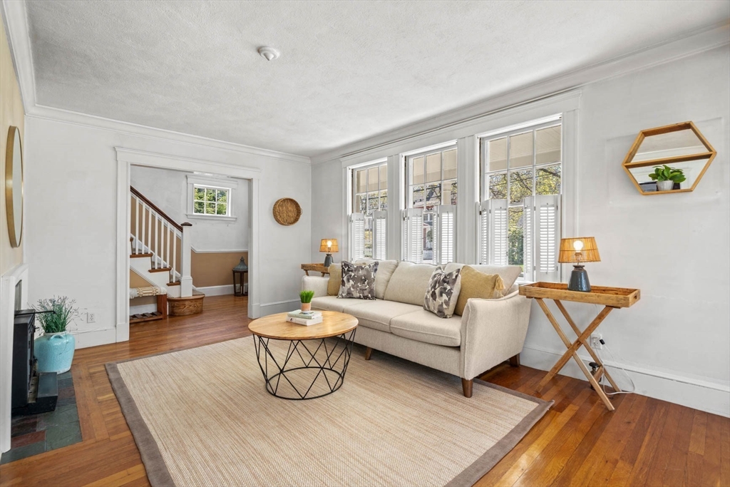 71 Woodside Road Winchester, MA 01890 - Photo 11 of 40 a living room with furniture and a window