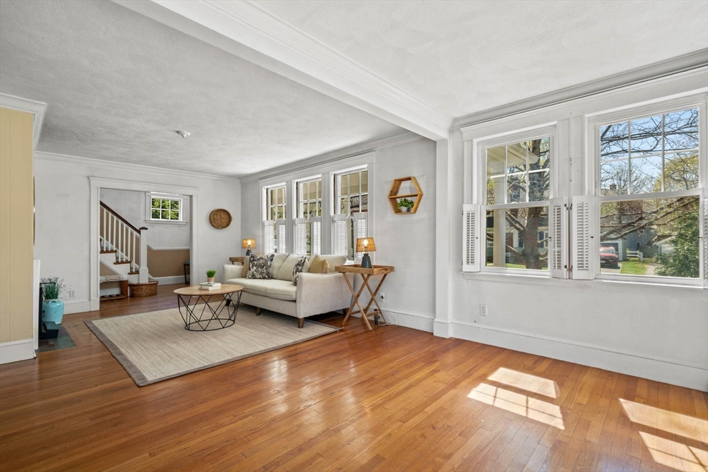 71 Woodside Road Winchester, MA 01890 - Photo 13 of 40 a living room with furniture and a large window