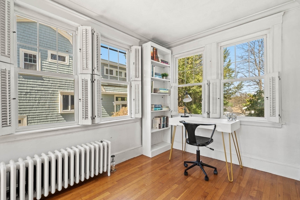 71 Woodside Road Winchester, MA 01890 - Photo 14 of 40 a view of a workspace with furniture and a window