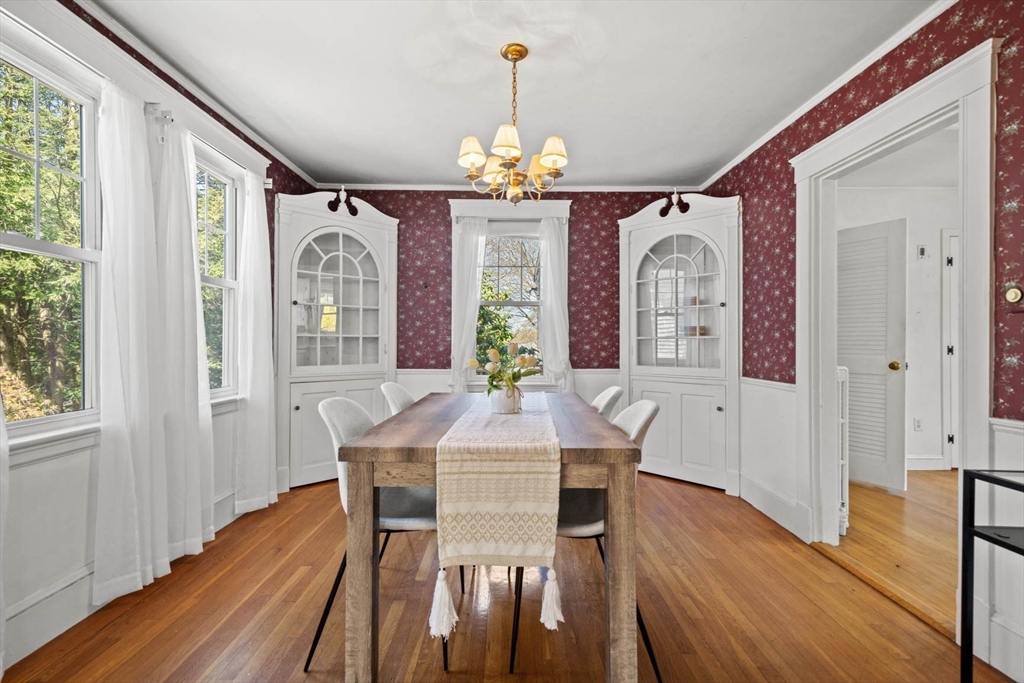 71 Woodside Road Winchester, MA 01890 - Photo 15 of 40 a view of a dining room with furniture window and wooden floor