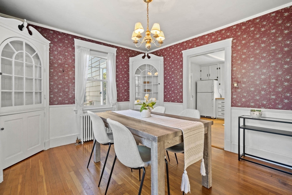 71 Woodside Road Winchester, MA 01890 - Photo 16 of 40 a view of a dining room with furniture and wooden floor