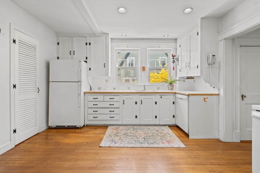 71 Woodside Road Winchester, MA 01890 - Photo 18 of 40 a view of kitchen with wooden floor