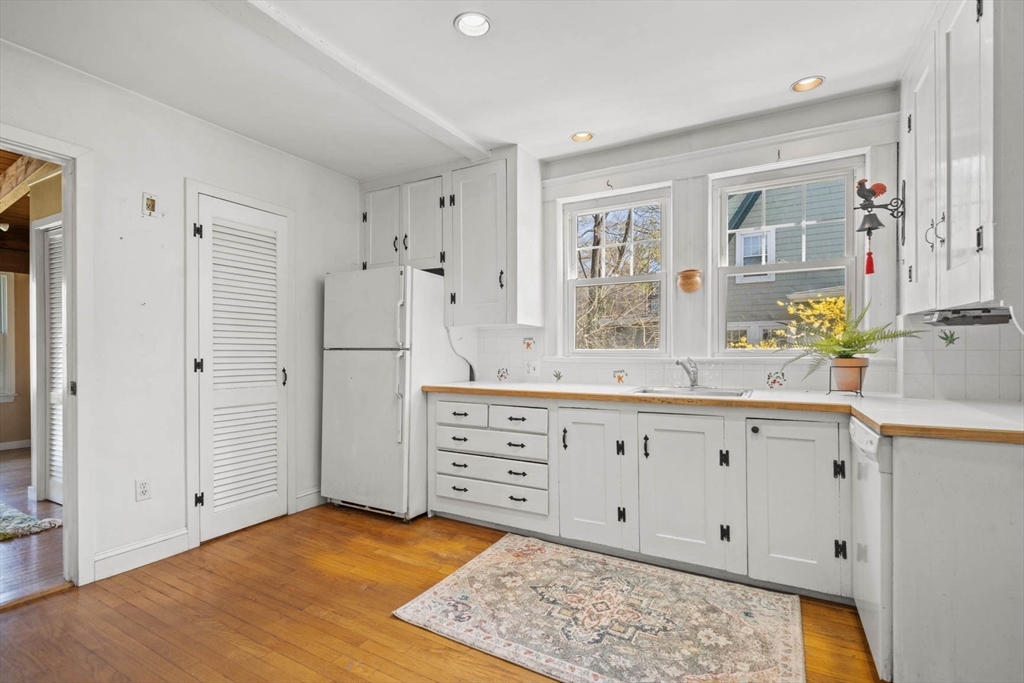 71 Woodside Road Winchester, MA 01890 - Photo 20 of 40 a spacious bathroom with double vanity sink and a mirror