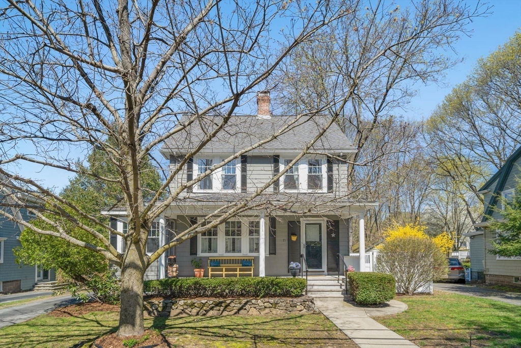 71 Woodside Road Winchester, MA 01890 - Photo 3 of 40 a front view of a residential apartment building with a yard and large tree