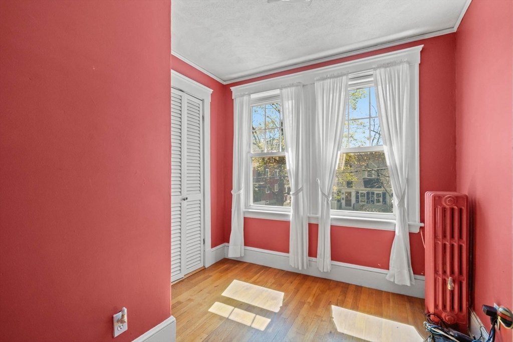 71 Woodside Road Winchester, MA 01890 - Photo 31 of 40 a view of an empty room with a window