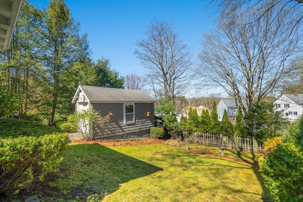 71 Woodside Road Winchester, MA 01890 - Photo 34 of 40 a front view of house with yard and green space