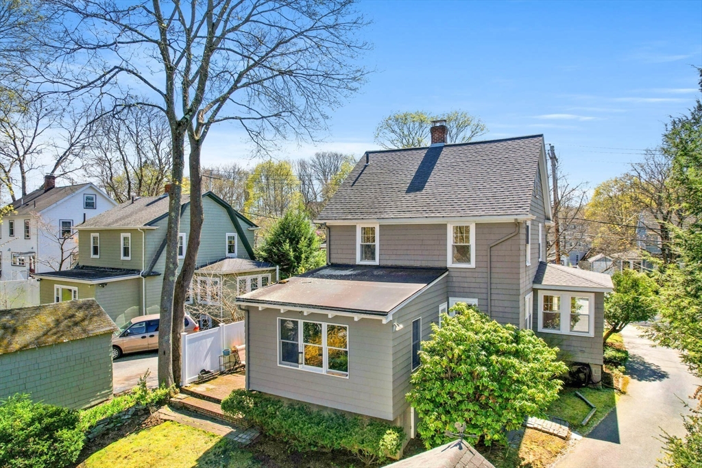 71 Woodside Road Winchester, MA 01890 - Photo 5 of 40 a aerial view of a house with a yard