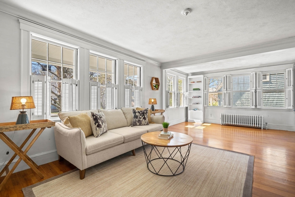 71 Woodside Road Winchester, MA 01890 - Photo 10 of 40 a living room with furniture and a large window