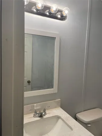 a bathroom with a sink and a toilet