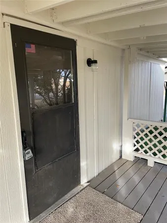 a view of a wooden door of a house