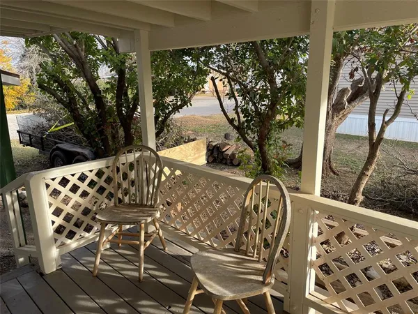 a view of balcony with wooden floor