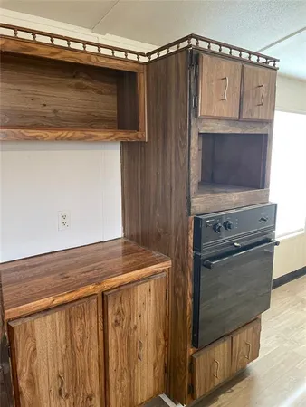 a kitchen with a stove and a microwave