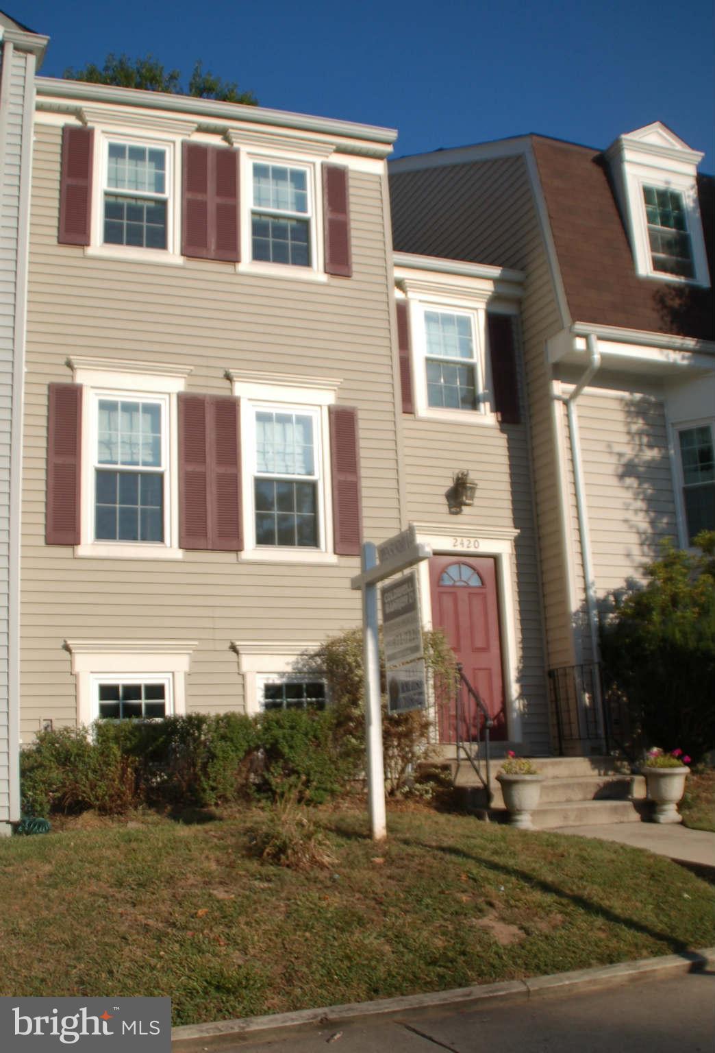 2420 Ridgehampton Court Reston, VA 20191 - Photo 1 of 16 a front view of a house with garden