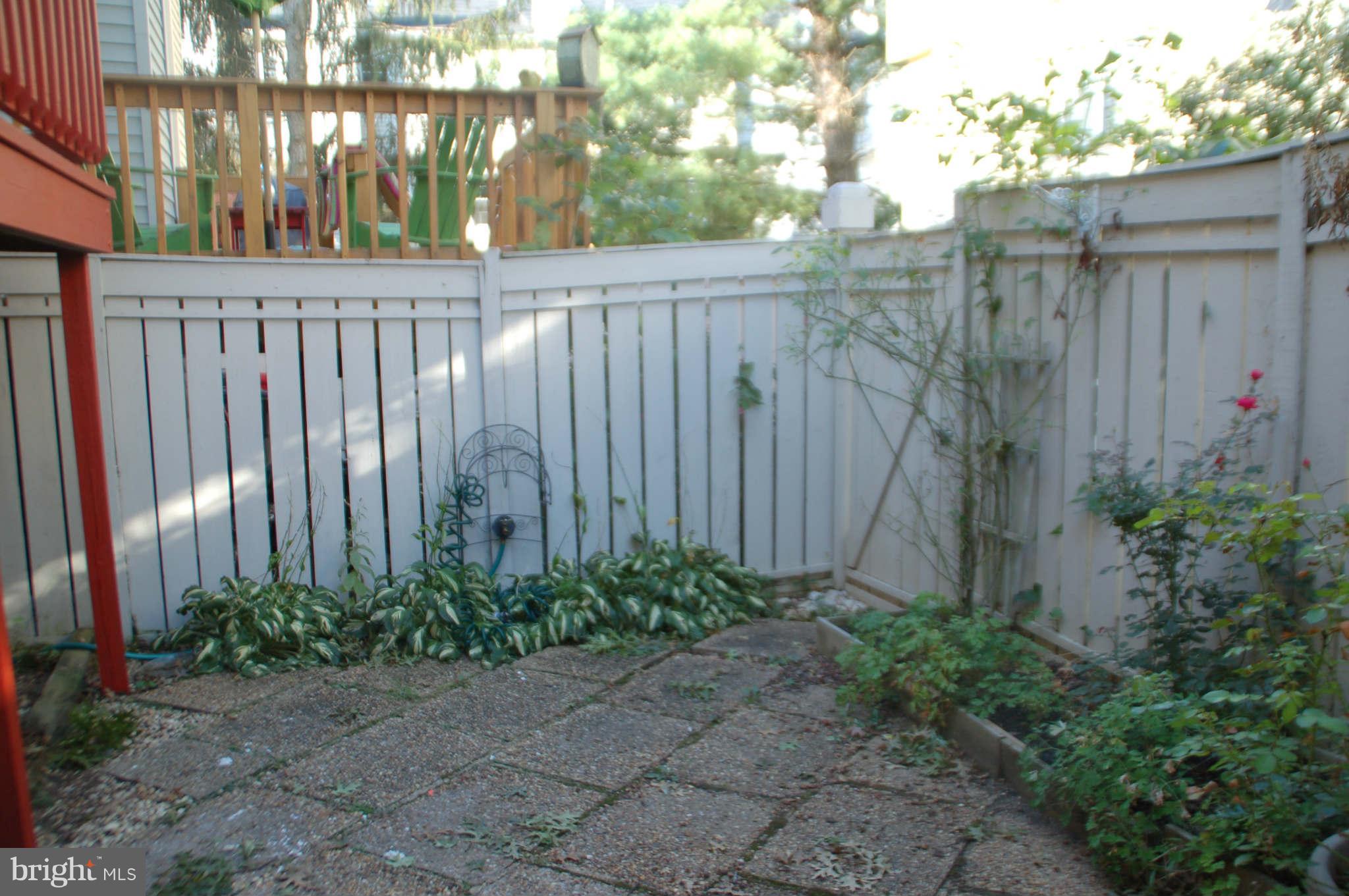2420 Ridgehampton Court Reston, VA 20191 - Photo 13 of 16 a view of a entrance with a wooden fence