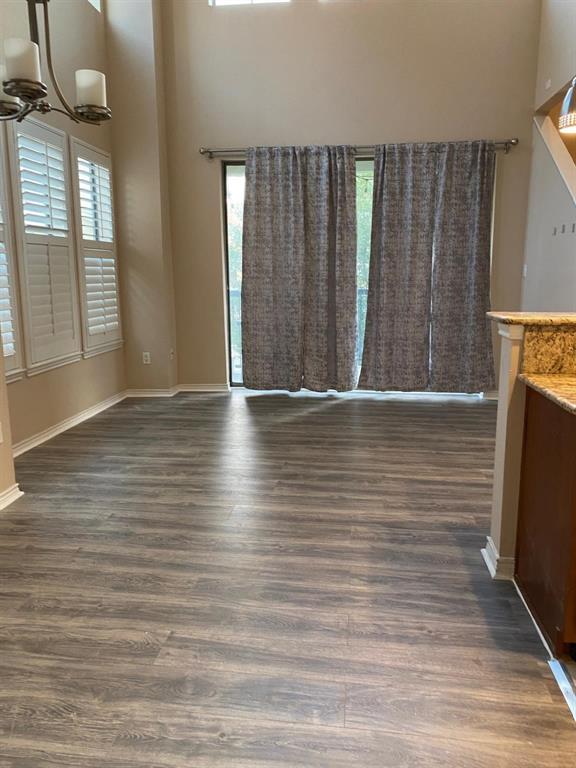 2018 Azure Pointe Richardson, TX 75080 - Photo 4 of 8 a view of hallway with wooden floor and stairs