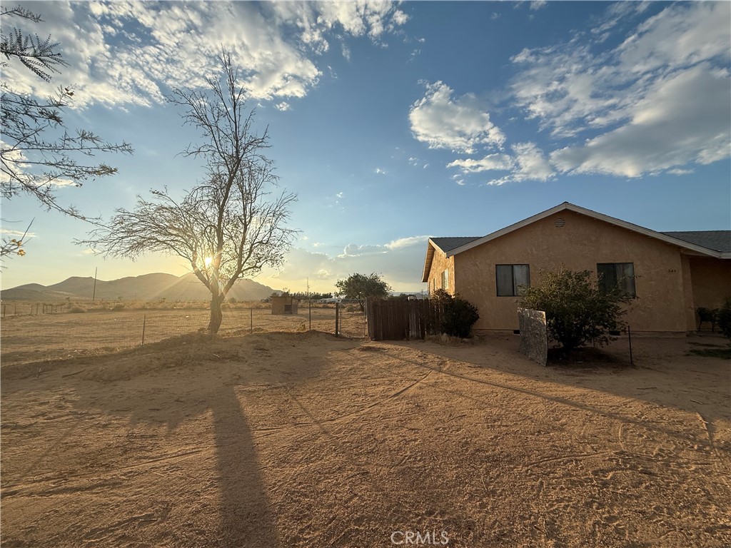 243 Balboa Avenue Mojave, CA 93501 - Photo 20 of 75 a view of a house with a yard