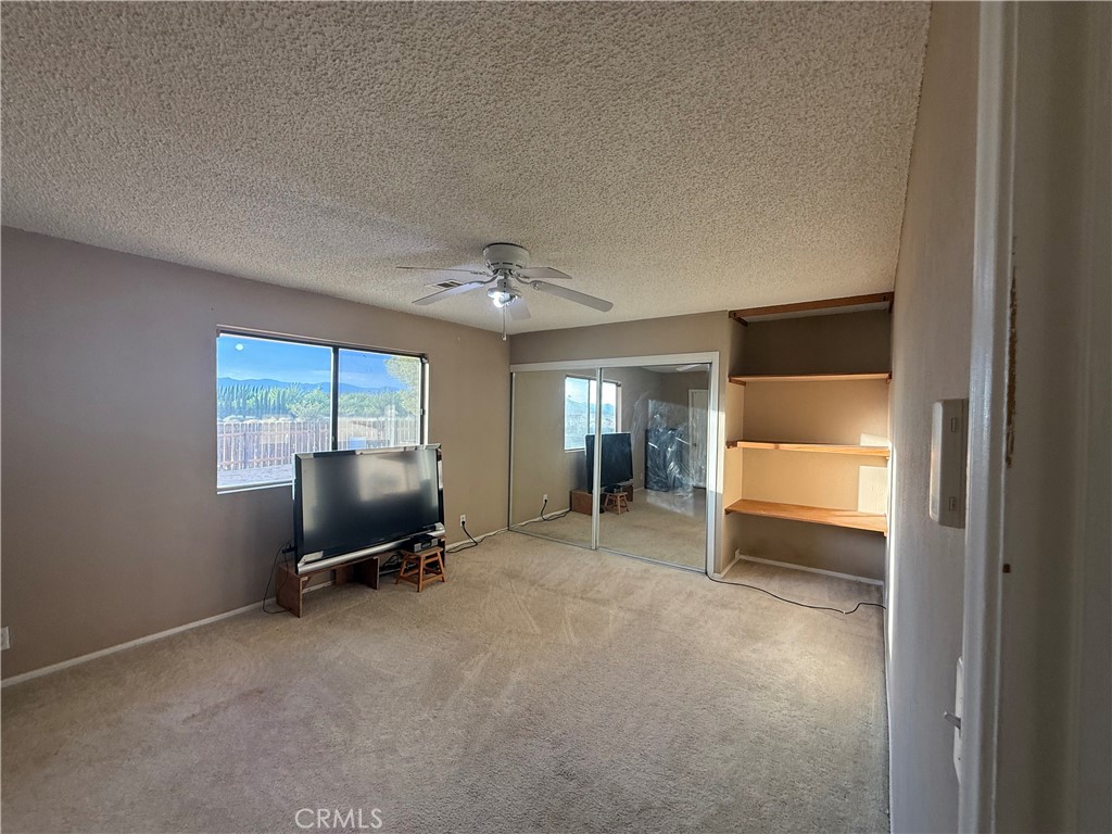 243 Balboa Avenue Mojave, CA 93501 - Photo 26 of 75 a view of a workspace with furniture and a window