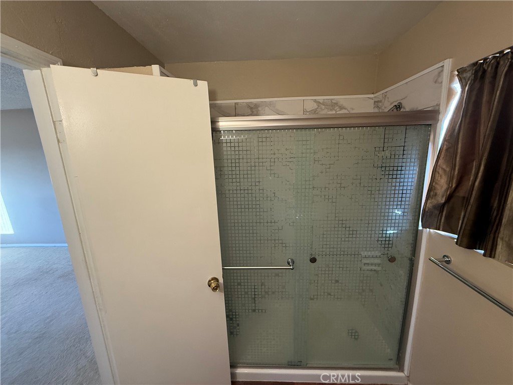 243 Balboa Avenue Mojave, CA 93501 - Photo 33 of 75 a bathroom with a shower and a sink