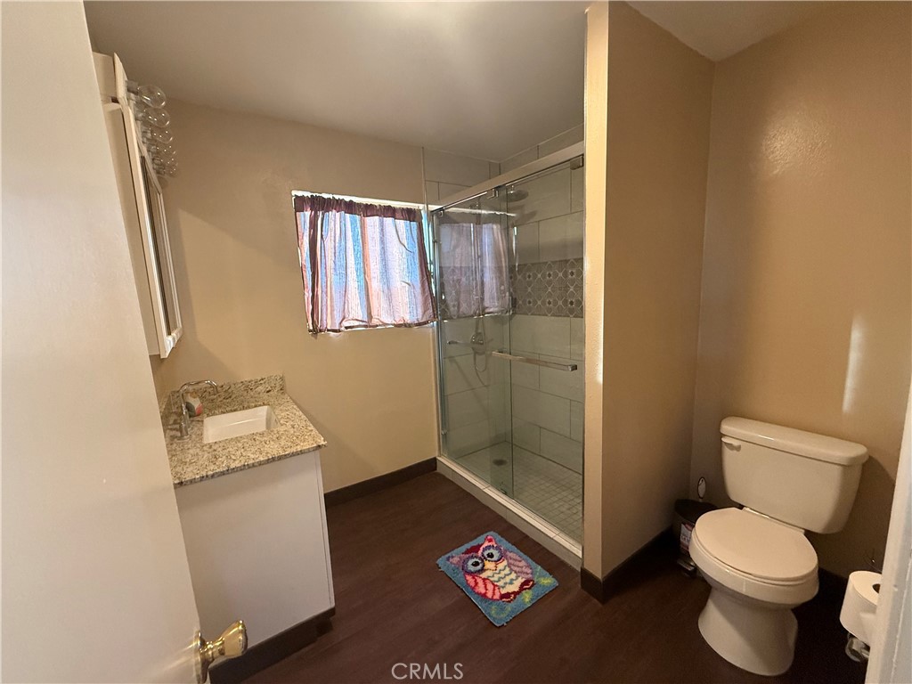 243 Balboa Avenue Mojave, CA 93501 - Photo 37 of 75 a bathroom with a toilet and a shower