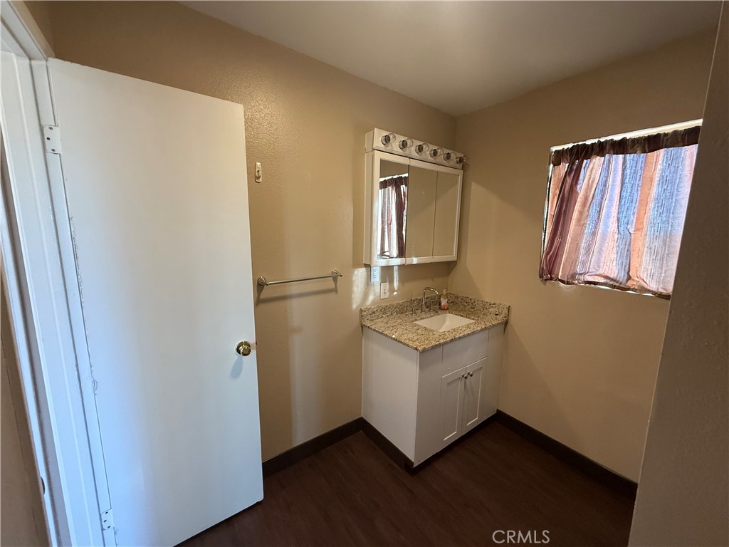 243 Balboa Avenue Mojave, CA 93501 - Photo 38 of 75 a kitchen with a refrigerator and a stove top oven