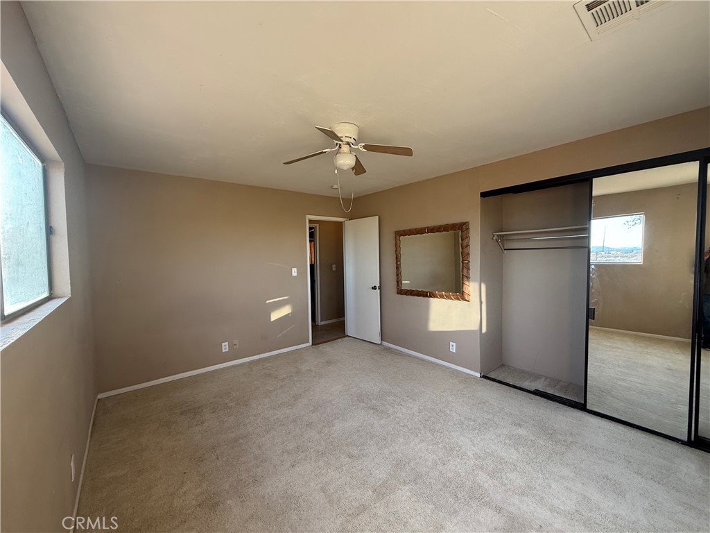 243 Balboa Avenue Mojave, CA 93501 - Photo 41 of 75 an empty room with a empty space and windows