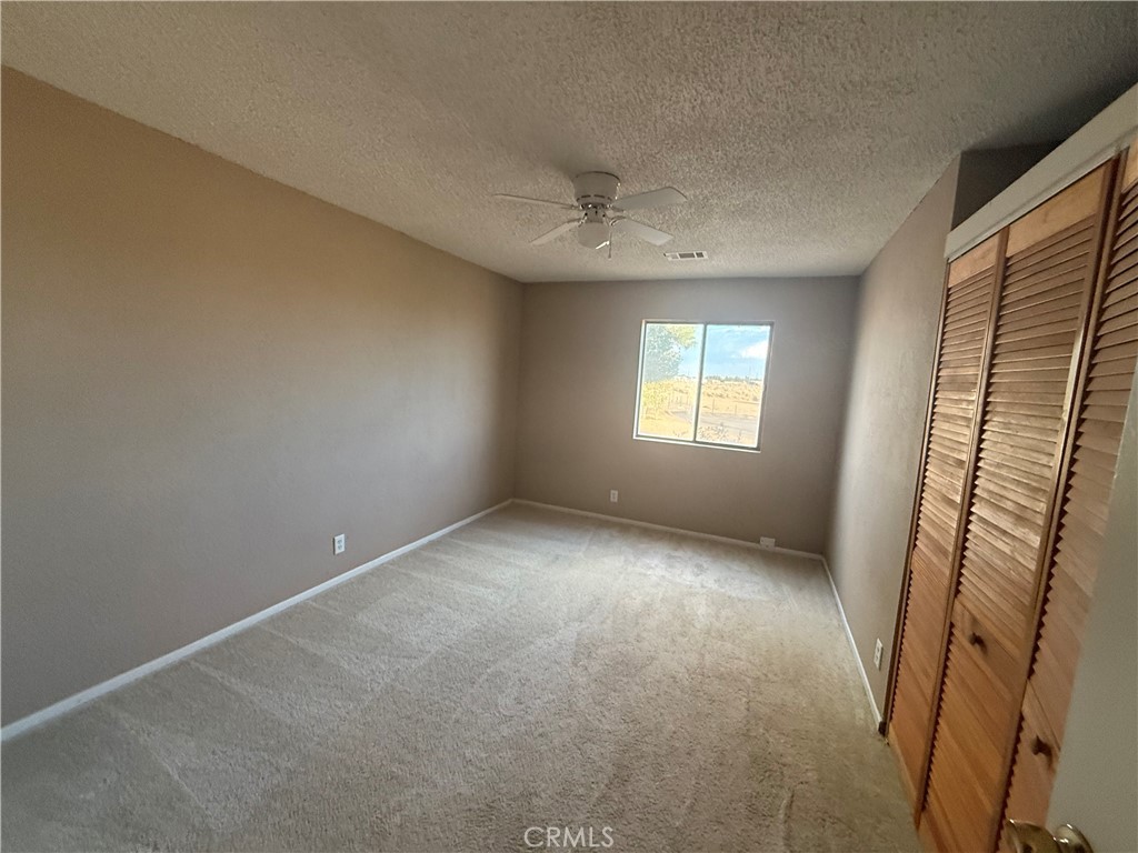 243 Balboa Avenue Mojave, CA 93501 - Photo 45 of 75 an empty room with windows and entrance