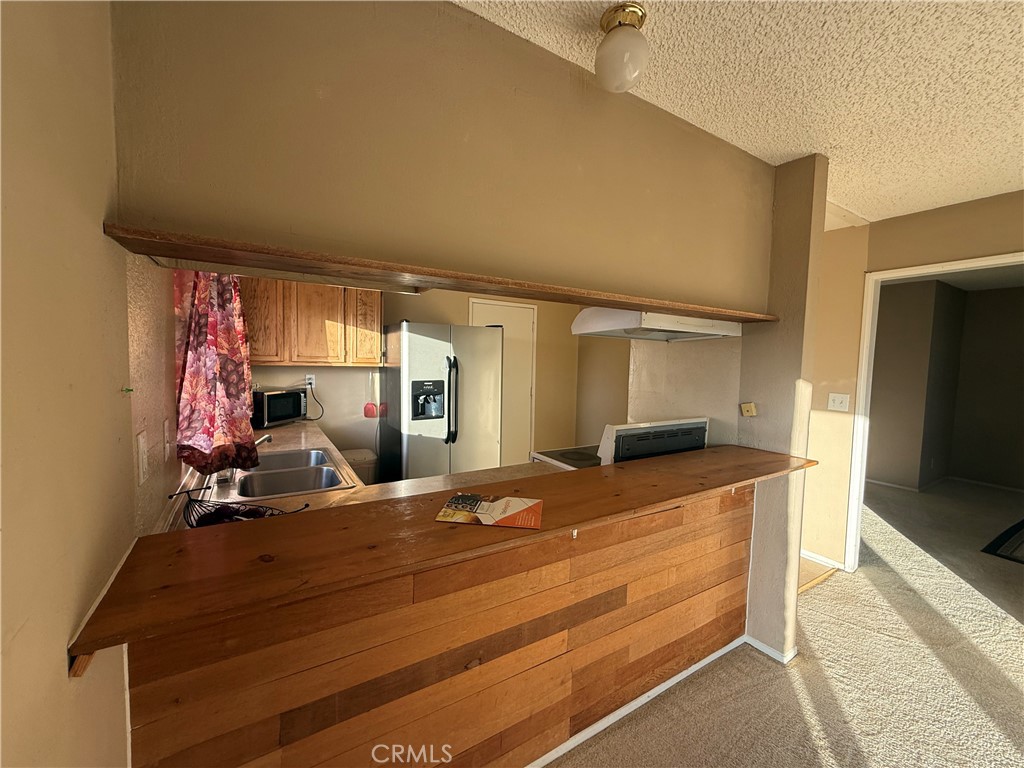 243 Balboa Avenue Mojave, CA 93501 - Photo 55 of 75 a room with gym equipment and flat screen tv