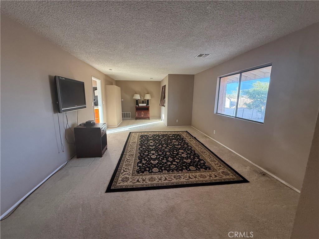 243 Balboa Avenue Mojave, CA 93501 - Photo 60 of 75 a living room with furniture rug and a window