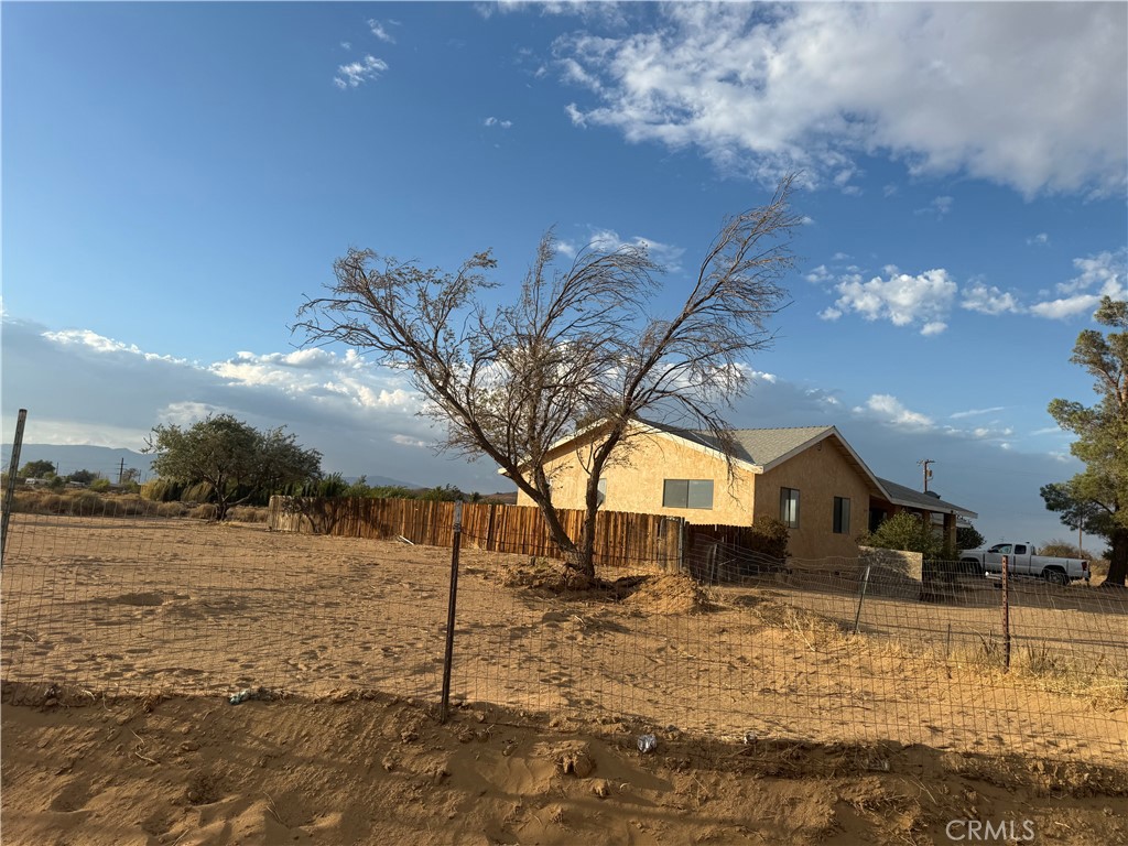 243 Balboa Avenue Mojave, CA 93501 - Photo 72 of 75 a view of a yard with a house