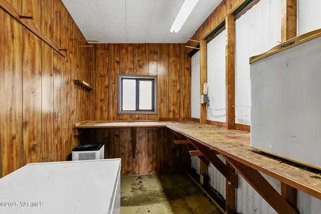 a kitchen with a sink and a large window