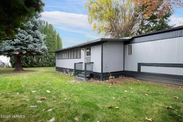 a backyard of a house with lots of green space