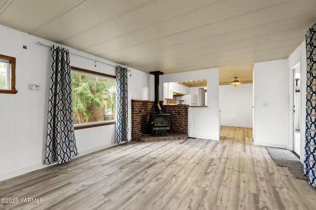 a view of a kitchen with wooden floor