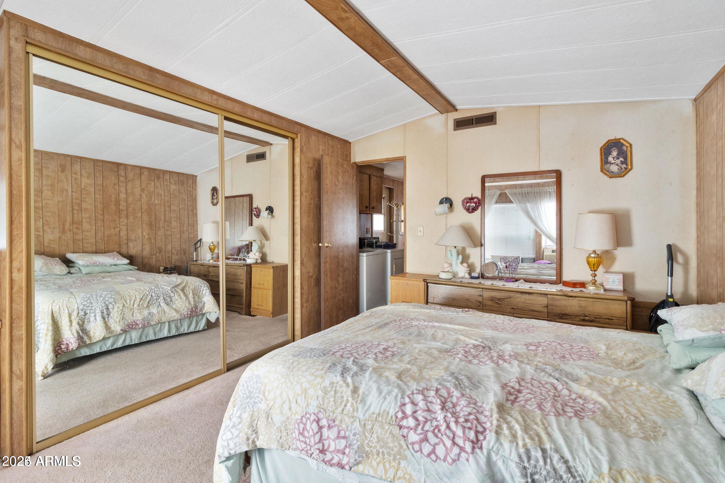 3330 East Main Street, Unit 9 Mesa, AZ 85213 - Photo 13 of 21 a bedroom with a large bed and a large mirror