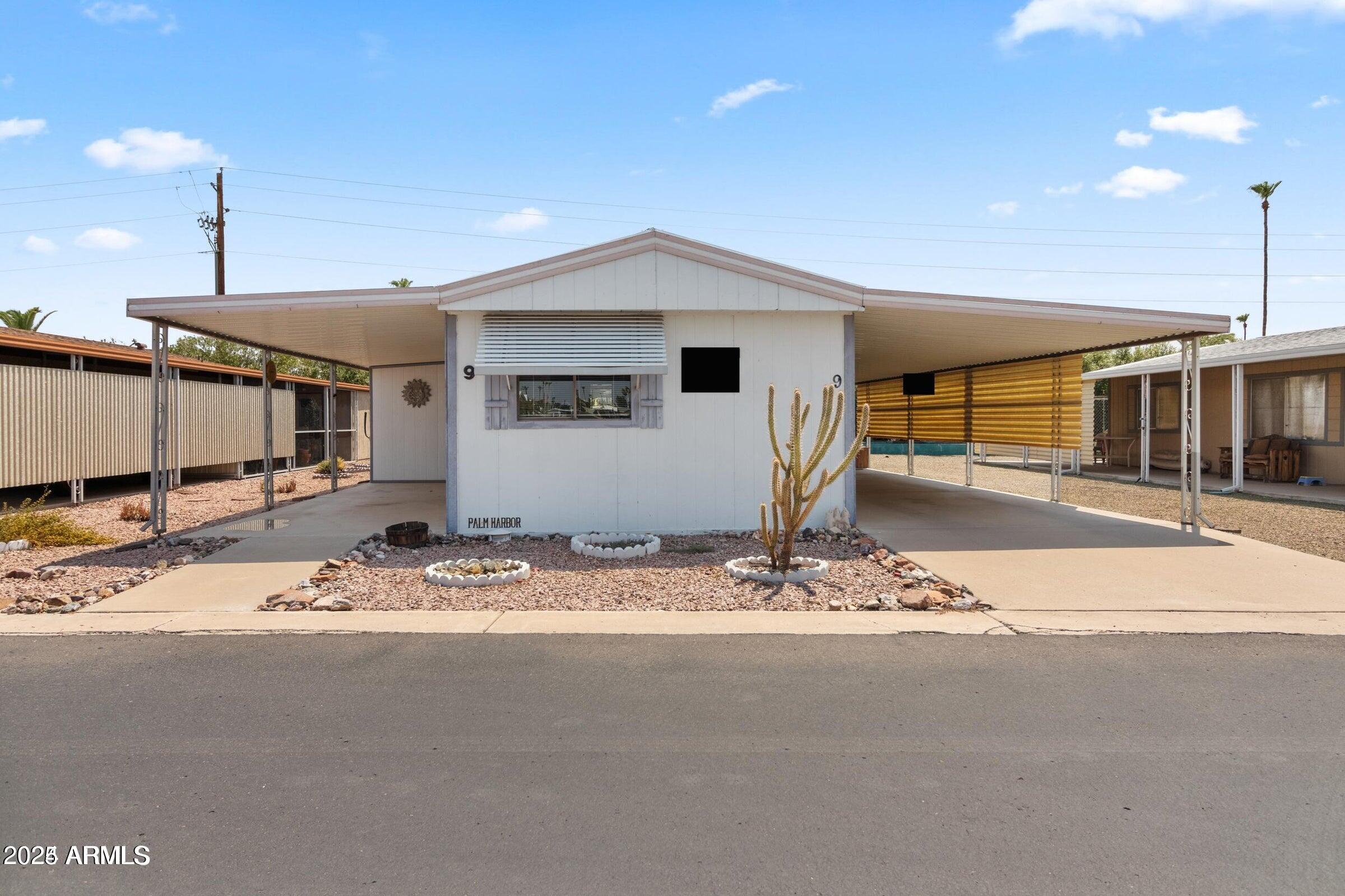3330 East Main Street, Unit 9 Mesa, AZ 85213 - Photo 2 of 21 a view of a house with a snow on the side of it