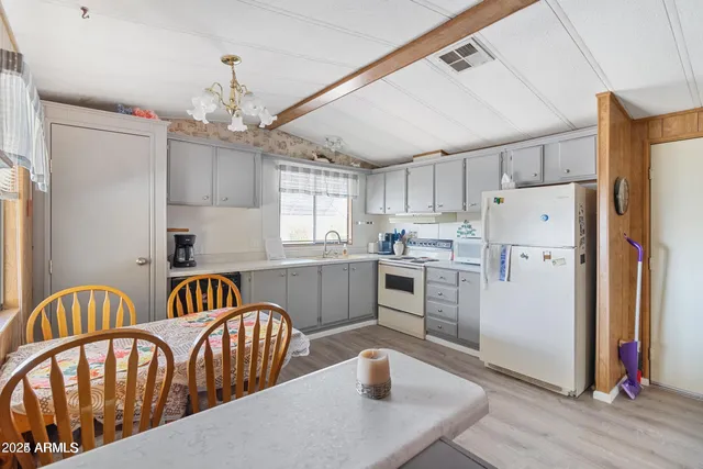 a kitchen with a stove and a refrigerator