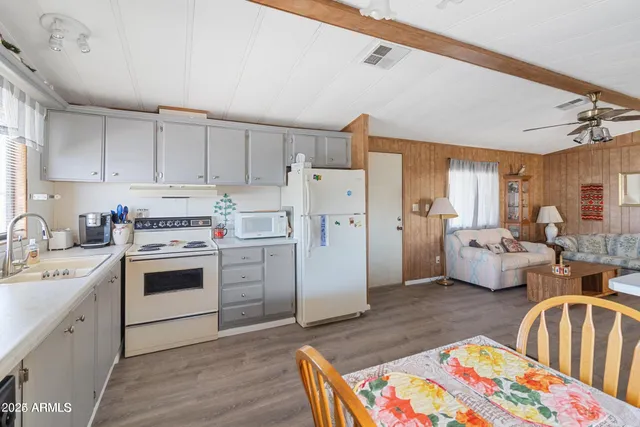 a spacious bedroom with a bed and furniture