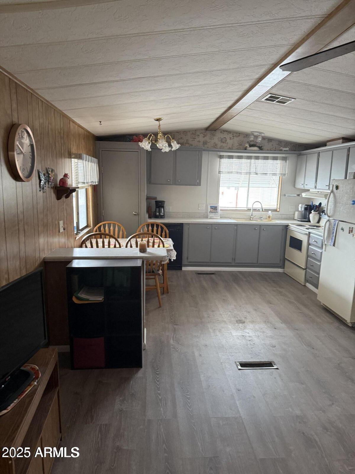 3330 East Main Street, Unit 9 Mesa, AZ 85213 - Photo 10 of 21 a kitchen with a stove and a refrigerator
