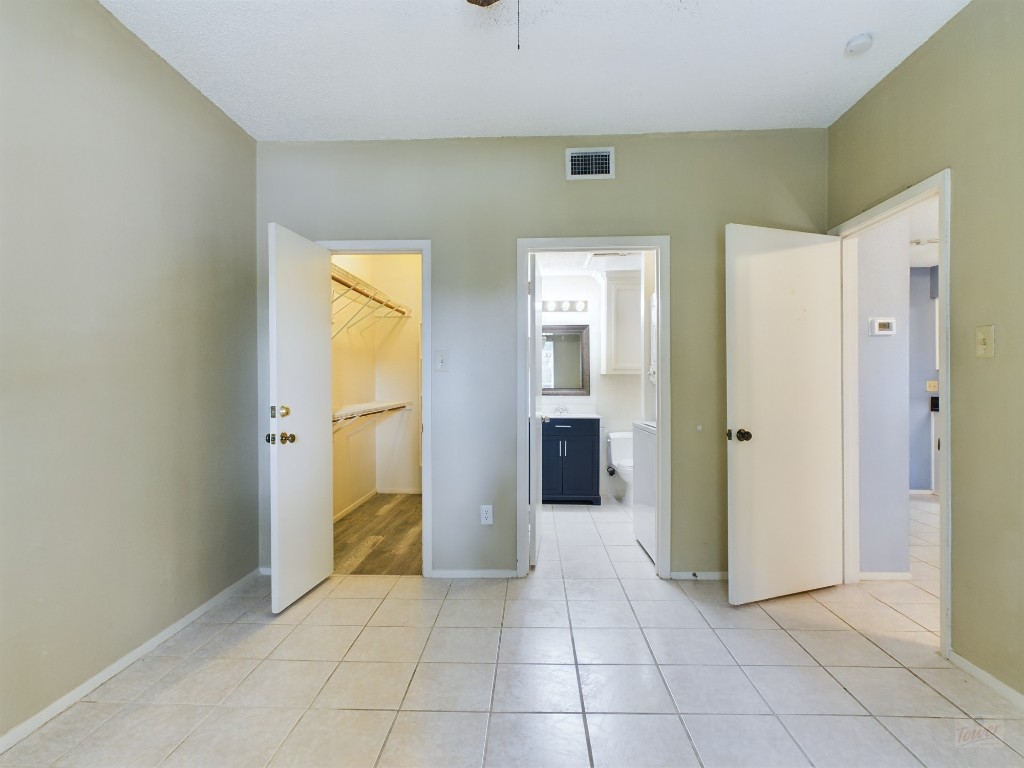 114 East 31st Street, Unit 113 Austin, TX 78705 - Photo 11 of 18 a view of a hallway with a bathroom and a sink
