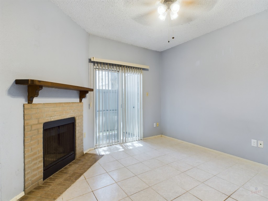 114 East 31st Street, Unit 113 Austin, TX 78705 - Photo 2 of 18 a view of an empty room with a fireplace