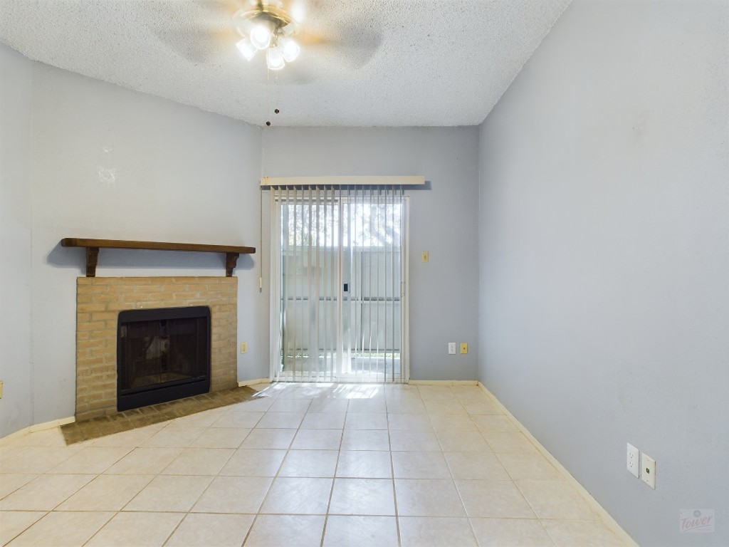 114 East 31st Street, Unit 113 Austin, TX 78705 - Photo 4 of 18 a view of an empty room with a fireplace